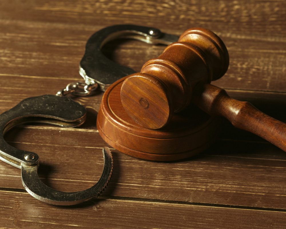 Close-up view of brown wooden mallet of judge
